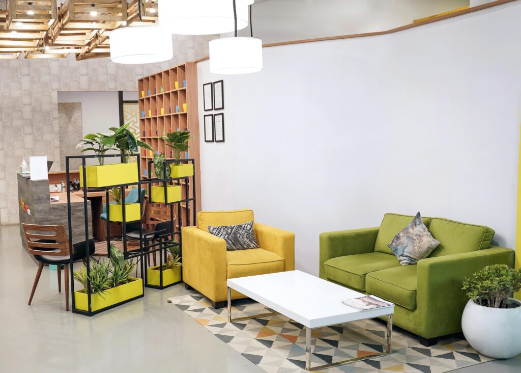Bright modern living room featuring green and yellow furnishings, perfect for a contemporary home or office space.